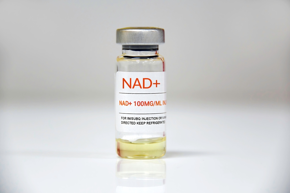 NAD+ injection vial labeled 100mg/mL, designed for intramuscular or subcutaneous use, with storage instructions to keep refrigerated.